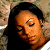 Pixelated close-up of a person with dark hair and closed eyes against a blurred background, rendered in low-resolution 256x256 pixels.
