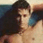 A pixelated image shows a shirtless person with dark hair holding another individual against a green background, accompanied by orange text and heart symbols.