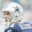 Pixelated image of a person in a white helmet and blue jersey with red text reading "#1 Go Cowboys Bledsoe Do" on a black background.