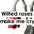 Pixelated image with gray arches, red liquid-like shapes, and black text reading "Wilted roses make me cry" on white background.