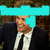A person in a dark suit and white shirt smiles while standing against a blurred background, with cyan pixelated text overlay on the top-left.