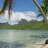 Pixelated beach scene with palm trees and water on left; green text 'wish...', 'I', 'was', 'here' on cyan background.