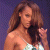 Pixelated image of a woman with long brown hair in a white strapless dress on the left, next to green text reading "Original Icons .com" on a dark background.