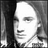 Black-and-white pixelated image of a person with long hair, accompanied by multiple text overlays in blocky digital font.
