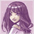 Pixelated image of a figure with long purple hair, light skin, and a white top against a pale pink background.