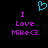 A static pixel art image with a black background, featuring a cyan heart symbol above purple text reading "I Love Mike<3" in two identical vertical