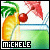 Pixelated icon shows a yellow lemon slice with green leafy top, red cherry on stem, and blue-green background; black banner at bottom contains white text 'MICHELE'.