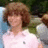 A pixelated image of a person with brown hair in a white polo shirt on the left, next to pink background text reading MIKEY IS THE COOLIST KID ON EARTH and three emoticons.