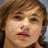 Static pixelated image of a person with light brown hair and closed eyes, showing partial facial features including nose and lips.