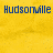 Yellow background with blue pixelated text reading Hudsonville, GG, and is the best in separate sections.