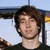 A person with brown hair and a black shirt appears in a of four , with the rightmost blank