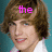 A pixelated image of a person with brown hair and a white shirt against a teal background, with pink text reading 'the' at the top left and 'hottie' at the top right.