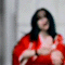 A person in a red kimono with white cloud patterns performs sequential hand gestures against a light gray tiled background.