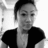 Black-and-white image of a person in four showing slight head and eye position changes across frames
