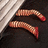 Pixelated image of two worm-like creatures under a wooden structure with red text warning about falling.