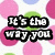 Pixelated text fragments on a polka-dot background with pink, green, and blue circles; the word 'SMILE' is prominent in bold white letters.