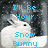Pixelated image of a white rabbit with black eyes against dark gray background, overlaid with blue text reading "I'll Be Your Snow Bunny".