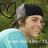 Pixelated image of a person in light blue shirt and dark cap with green foliage background, alongside pink text on bright cyan field.