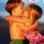 Two children embrace in a close hug, one wearing green shorts and the other pink patterned clothing against a blue sky background.