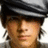 Pixelated image of a person wearing a gray flat cap with text overlays on black background.