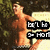 Pixelated image of a shirtless person with light skin standing against dark foliage, holding two black-and-white text signs.