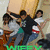Group of people in dynamic poses with green text at bottom, showing slight movement in limbs and background elements.