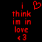 Red pixelated text on black background reads 'i think im in love <3' with a red heart symbol above the first line.