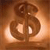 A pixelated brown symbol resembling a stylized dollar sign with a circular top and two curved loops below, set against a gradient background of warm brown and orange hues.