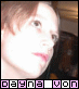 A person with light brown hair and pink lips appears in two side-by-side frames with a bright overexposed face, below a of pixelated text characters