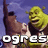 Shrek character with green skin and brown clothing, holding a raised arm against a purple sky background.