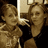 Pixelated photo of two people on left, bright pink background with white text listing names and 'like' on right.