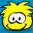 Pixelated yellow cartoon character with spiky hair, large white eyes with black pupils, and a small curved mouth on blue background.