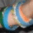 A pixelated image shows a person's face with blue and orange tones on the left, next to black text reading 'still a role model for me.'