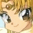A 48x48 pixel buddy icon featuring a close-up of an anime-style character with blonde hair and large eyes on the left, paired with text reading "Anime IM" and "COM" on a black background to the right.