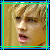 Pixelated image of a person with light brown hair and open mouth, next to text reading "I LOVE JESSE McCARTNEY" in blue and green pixel font on black background.