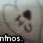 Pixelated heart-shaped icon with dark eye-like shapes and mouth, displaying "ntmos." text at bottom left in black bar.
