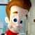 A split-frame contact sheet showing a cartoon character on the left and green text on a dark background on the right, both in pixelated style.