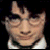 Pixelated image of a person with dark hair and glasses, split into two showing different facial expressions