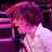 Pixelated image of a person with purple hair and white clothing, next to bright pink text on black background.
