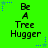 Green background with blue and light green star-shaped pixel clusters; text reads 'Be A Tree Hugger' in black block letters.