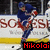 Hockey player in blue uniform with red accents skating on ice, holding a hockey stick, with visible text overlays and a blurred arena background.