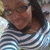 A person wearing a striped shirt with alternating dark and light horizontal stripes, visible in a static image with no motion.