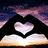 Four heart-shaped images arranged in a : sunset silhouette, sand drawing, colorful sand, and snow drawing