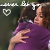 Two people embrace in a close-up; one wears a purple garment while the other's hand rests on it, with white text and a heart symbol overlaid.