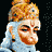 A 2x2 contact sheet of four pixelated frames showing a character with golden crown, blue face, and red markings across different poses and backgrounds.
