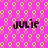 A static image with a bright pink background patterned with yellow and light pink circular shapes, featuring four instances of the name "julie" in black pixelated text.