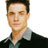 Static 48x48 pixel icon of a person with short dark hair wearing a black jacket over a light-colored collared shirt against a white background.