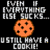 Pixelated image with text and character elements, including a cookie, a yellow figure, and a purple background with a mountain-like shape.