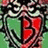 A pixelated image with a green background, red text reading 'have a jonas filled christmas :D', and a stylized character face on the left.