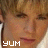 Static 48x48 pixel icon showing a close-up of a person's face with the word "YUM" in white block letters at the bottom left, rendered in low-resolution pixel art style with brown and beige tones.